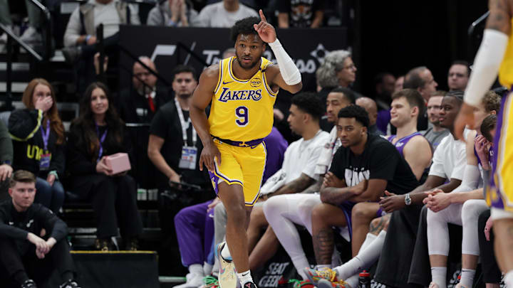 Feb 12, 2025; Salt Lake City, Utah, USA;  Los Angeles Lakers guard Bronny James (9) celebrates after making a three point basket during the second half against the Utah Jazz at Delta Center. Mandatory Credit: Chris Nicoll-Imagn Images