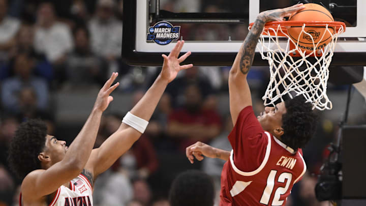 Arkansas center Malique Ewin scores past Arizona forward Koa Peat (10) in the first half during a Sweet Sixteen game of the West Regional of the men's 2026 NCAA Tournament at SAP Center. Arkansas center Malique Ewin scores past Arizona forward Koa Peat (10) in the first half during a Sweet Sixteen game of the West Regional of the men's 2026 NCAA Tournament at SAP Center.