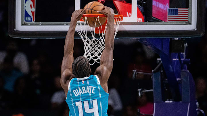 Mar 8, 2025; Charlotte, North Carolina, USA; Charlotte Hornets forward Moussa Diabate (14) dunks against the Brooklyn Nets during the second quarter at Spectrum Center. Mandatory Credit: Scott Kinser-Imagn Images