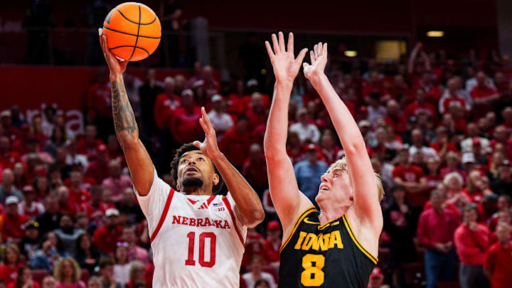 Mar 8, 2026; Lincoln, Nebraska, USA; Nebraska Cornhuskers guard Jamarques Lawrence (10) shoots against Iowa Hawkeyes forward Cooper Koch (8) during the first half at Pinnacle Bank Arena. Mandatory Credit: Dylan Widger-Imagn Images