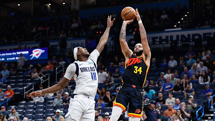 Apr 14, 2024; Oklahoma City, Oklahoma, USA; Oklahoma City Thunder forward Kenrich Williams (34) shoots as Dallas Mavericks forward Olivier-Maxence Prosper (18) defends during the second half at Paycom Center. Mandatory Credit: Alonzo Adams-Imagn Images