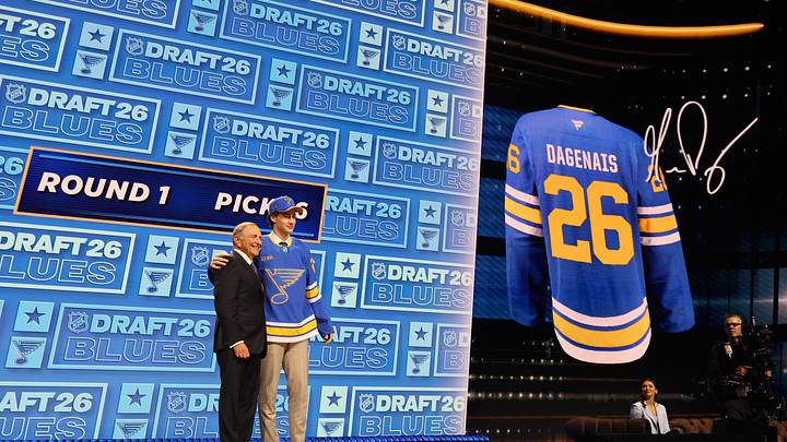 Jun 26, 2026; Buffalo, New York, USA; Maddox Dagenais reacts beside NHL commissioner Gary Bettman after being selected with the sixteenth pick in the first round of the 2026 NHL Draft by the St. Louis Blues at KeyBank Center. Mandatory Credit: Timothy T. Ludwig-Imagn Images