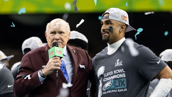 Feb 9, 2025; New Orleans, LA, USA; Fox Sports announcer Terry Bradshaw interviews Philadelphia Eagles quarterback Jalen Hurts (1) after defeating the Kansas City Chiefs during Super Bowl LIX at Ceasars Superdome. Mandatory Credit: Mark J. Rebilas-Imagn Images