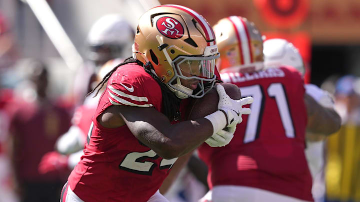 Oct 6, 2024; Santa Clara, California, USA; San Francisco 49ers running back Jordan Mason (24) carries the ball against the Arizona Cardinals during the second quarter at Levi's Stadium. Mandatory Credit: Darren Yamashita-Imagn Images