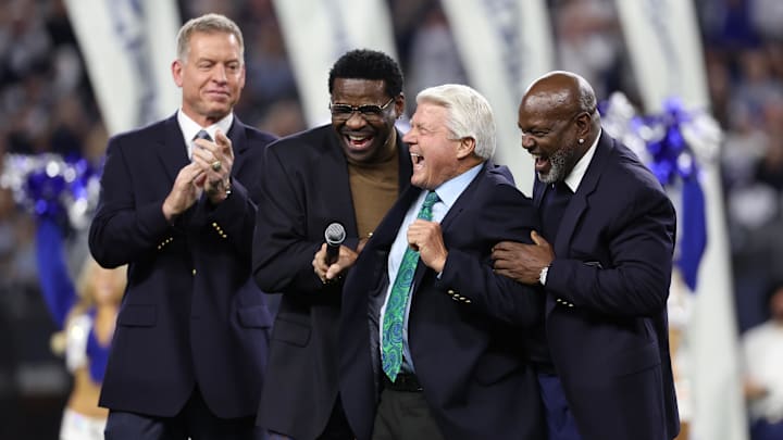 Dallas Cowboys former head coach Jimmy Johnson laughs with former players Troy Aikman, Michael Irvin, and Emmitt Smith.