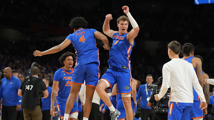 Florida Gators forward Sam Alexis and center Micah Handlogten celebrate after defeating the Auburn Tigers in the semifinals of the men's Final Four of the 2025 NCAA Tournament at the Alamodome.