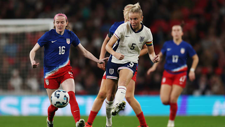 Leah Williamson battles for the ball during England vs USA 