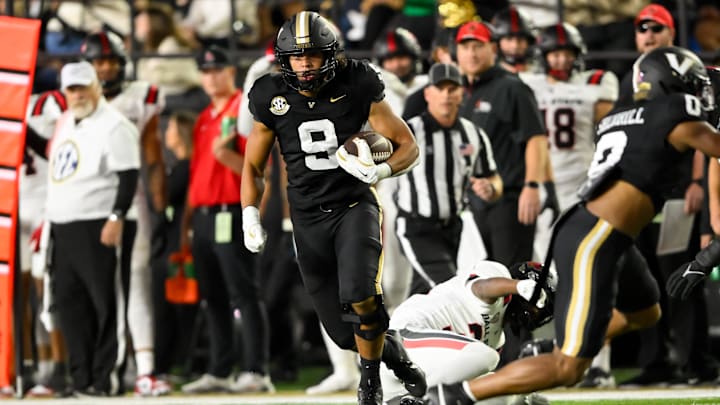 Oct 19, 2024; Nashville, Tennessee, USA;  Vanderbilt Commodores tight end Eli Stowers (9) runs the ball against the Ball State Cardinals during the first half at FirstBank Stadium. Mandatory Credit: Steve Roberts-Imagn Images