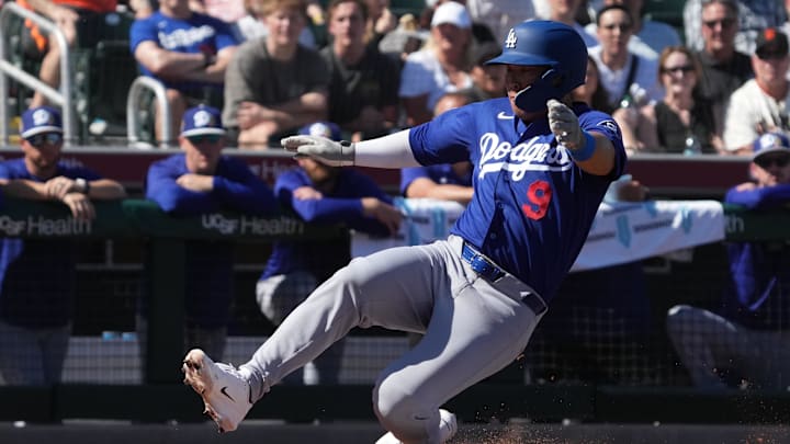 Feb 27, 2026; Scottsdale, Arizona, USA; Los Angeles Dodgers first baseman Keston Hiura (9) scores a run against the San Francisco Giants in the second inning at Scottsdale Stadium. Mandatory Credit: Rick Scuteri-Imagn Images Feb 27, 2026; Scottsdale, Arizona, USA; Los Angeles Dodgers first baseman Keston Hiura (9) scores a run against the San Francisco Giants in the second inning at Scottsdale Stadium. Mandatory Credit: Rick Scuteri-Imagn Images