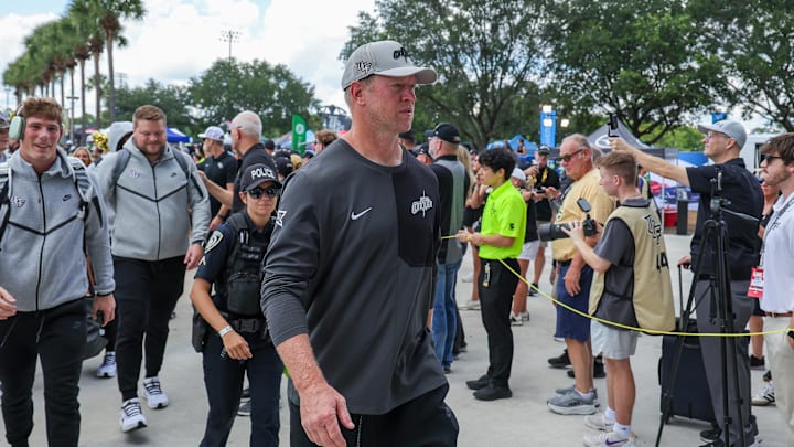 Sep 20, 2025; Orlando, Florida, USA; UCF Knights head coach Scott Frost walks into the venue before the game against the North Carolina Tar Heels at the Bounce House Stadium. Mandatory Credit: Mike Watters-Imagn Images