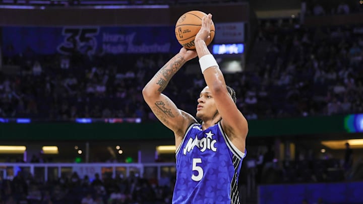 Orlando Magic forward Paolo Banchero (5) shoots a three-point basket during the second quarter against the Memphis Grizzlies at KIA Center. 