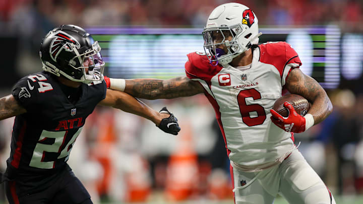 Jan 1, 2023; Atlanta, Georgia, USA; Arizona Cardinals running back James Conner (6) stiff arms