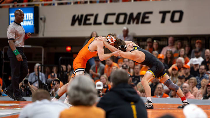 Feb 25, 2024; Stillwater, Okla, USA; Iowa's Drake Ayala wrestles Oklahoma State's Troy Spratley at 125lbs in front of a sold out crowd at Gallagher Iba Arena. Mandatory Credit: Mitch Alcala-The Oklahoman Feb 25, 2024; Stillwater, Okla, USA; Iowa's Drake Ayala wrestles Oklahoma State's Troy Spratley at 125lbs in front of a sold out crowd at Gallagher Iba Arena. Mandatory Credit: Mitch Alcala-The Oklahoman