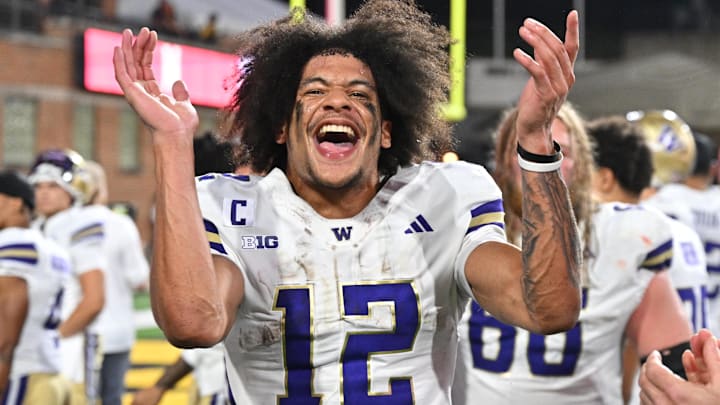 Oct 4, 2025; College Park, Maryland, USA;  Washington Huskies wide receiver Denzel Boston (12) celebrates after the Huskies comeback victory over the Maryland Terrapins at SECU Stadium. Mandatory Credit: Jamie Sabau-Imagn Images