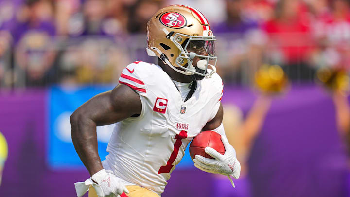 Sep 15, 2024; Minneapolis, Minnesota, USA; San Francisco 49ers wide receiver Deebo Samuel Sr. (1) runs back a kick against the Minnesota Vikings in the first quarter at U.S. Bank Stadium.