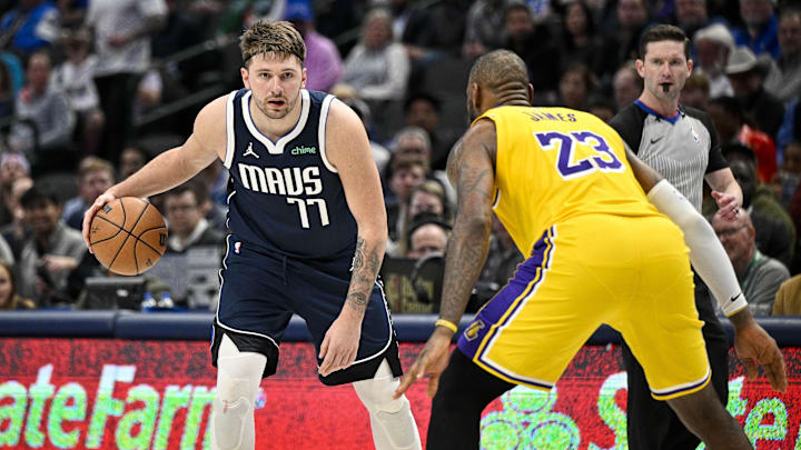 Dallas Mavericks guard Luka Doncic (77) and Los Angeles Lakers forward LeBron James (23) in action during the game between the Dallas Mavericks and the Los Angeles Lakers at the American Airlines Center. 