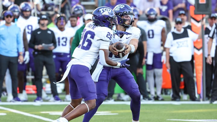 Oct 11, 2025; Manhattan, Kansas, USA; TCU Horned Frogs quarterback Josh Hoover (10) takes a handoff to running back Jeremy Payne (26) during the fourth quarter at Bill Snyder Family Football Stadium. Mandatory Credit: Scott Sewell-Imagn Images