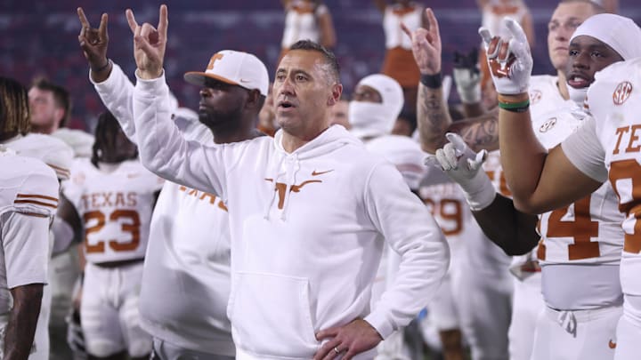 Texas Longhorns head coach Steve Sarkisian and team gesture after the game against the Georgia Bulldogs at Sanford Stadium. Texas Longhorns head coach Steve Sarkisian and team gesture after the game against the Georgia Bulldogs at Sanford Stadium.
