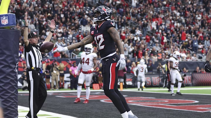 Dec 14, 2025; Houston, Texas, USA; Houston Texans wide receiver Nico Collins (12) celebrates after a touchdown during the second half against the Arizona Cardinals at NRG Stadium. Mandatory Credit: Troy Taormina-Imagn Images
