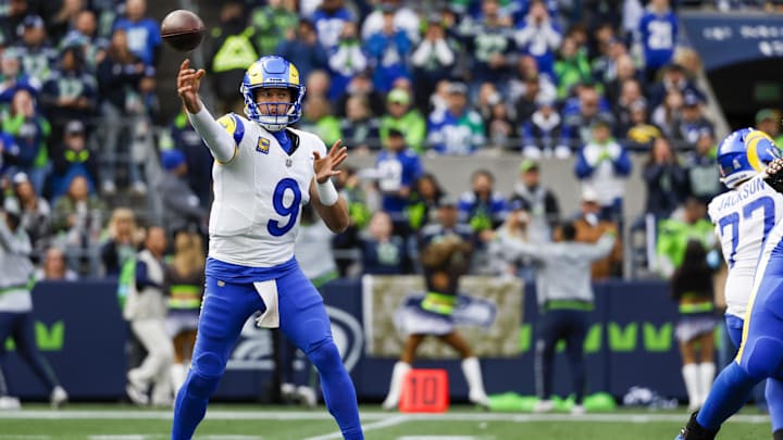 Nov 3, 2024; Seattle, Washington, USA; Los Angeles Rams quarterback Matthew Stafford (9) passes against the Seattle Seahawks during the first quarter at Lumen Field. Mandatory Credit: Joe Nicholson-Imagn Images