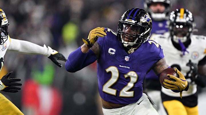 Jan 11, 2025; Baltimore, Maryland, USA; Baltimore Ravens running back Derrick Henry (22) runs against Pittsburgh Steelers linebacker Elandon Roberts (50) in the second quarter in an AFC wild card game at M&T Bank Stadium. Mandatory Credit: Tommy Gilligan-Imagn Images Jan 11, 2025; Baltimore, Maryland, USA; Baltimore Ravens running back Derrick Henry (22) runs against Pittsburgh Steelers linebacker Elandon Roberts (50) in the second quarter in an AFC wild card game at M&T Bank Stadium. Mandatory Credit: Tommy Gilligan-Imagn Images