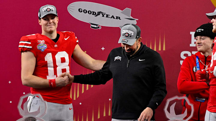 Jan 10, 2025; Arlington, TX, USA; Ohio State Buckeyes quarterback Will Howard (18) and head coach Ryan Day celebrate after the game between the Texas Longhorns and the Ohio State Buckeyes at AT&T Stadium. Mandatory Credit: Jerome Miron-Imagn Images Jan 10, 2025; Arlington, TX, USA; Ohio State Buckeyes quarterback Will Howard (18) and head coach Ryan Day celebrate after the game between the Texas Longhorns and the Ohio State Buckeyes at AT&T Stadium. Mandatory Credit: Jerome Miron-Imagn Images