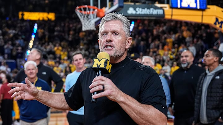 Michigan football head coach Kyle Whittingham speaks as he is being introduced on the floor during the first half between Michigan and USC at Crisler Center in Ann Arbor on Friday, Jan. 2, 2026.