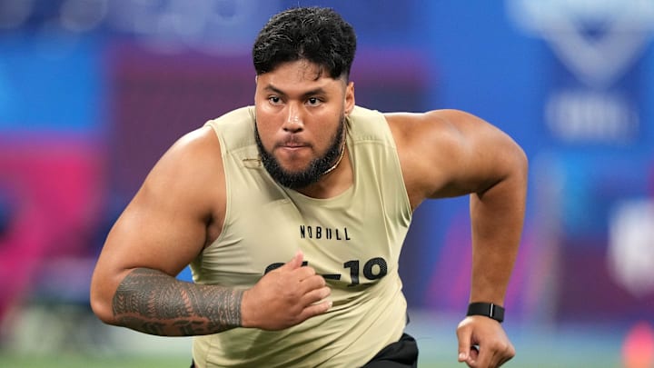 Mar 3, 2024; Indianapolis, IN, USA; Washington offensive lineman Troy Fautanu (OL19)