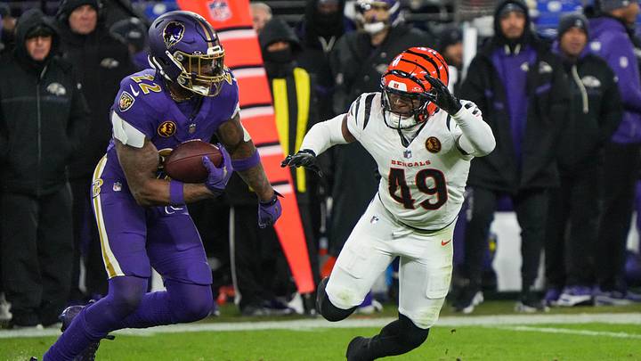 Bengals Barrett Carter (49) rushes Ravens Derrick Henry (22) during their game at M&T Bank Stadium on Thanksgiving Thursday November 27, 2025. The Bengals won the game with a final score of 33-14.