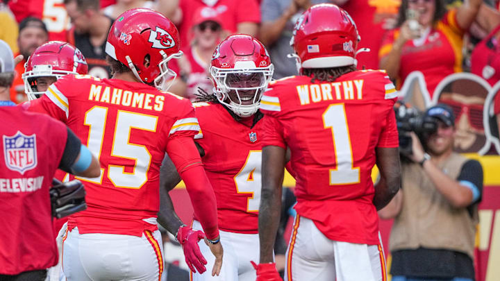Sep 15, 2024; Kansas City, Missouri, USA; Kansas City Chiefs wide receiver Rashee Rice (4) celebrates after scoring against the Cincinnati Bengals during the game at GEHA Field at Arrowhead Stadium. Mandatory Credit: Denny Medley-Imagn Images