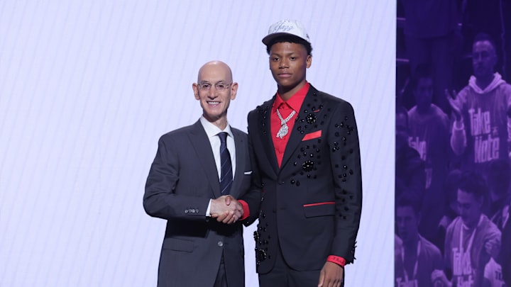 Jun 25, 2025; Brooklyn, NY, USA;  Ace Bailey stands with NBA commissioner Adam Silver after being selected as the fifth pick by the Utah Jazz in the first round of the 2025 NBA Draft at Barclays Center. Mandatory Credit: Brad Penner-Imagn Images