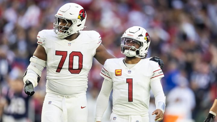 Dec 15, 2024; Glendale, Arizona, USA; Arizona Cardinals offensive tackle Paris Johnson Jr. (70) and quarterback Kyler Murray (1) against the New England Patriots at State Farm Stadium. Mandatory Credit: Mark J. Rebilas-Imagn Images Dec 15, 2024; Glendale, Arizona, USA; Arizona Cardinals offensive tackle Paris Johnson Jr. (70) and quarterback Kyler Murray (1) against the New England Patriots at State Farm Stadium. Mandatory Credit: Mark J. Rebilas-Imagn Images