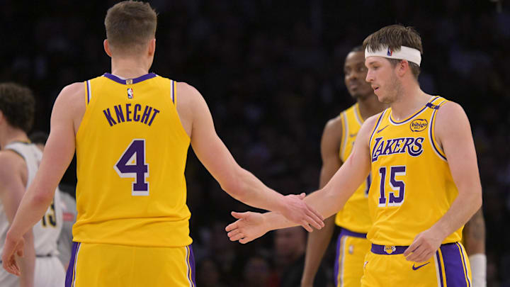 Los Angeles Lakers guard Dalton Knecht (4) and guard Austin Reaves (15) on the court in the first half against the Denver Nuggets at Crypto.com Arena.