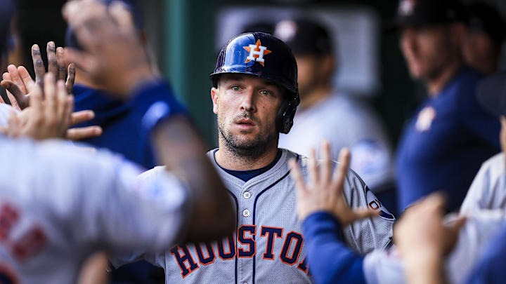Sep 4, 2024; Cincinnati, Ohio, USA; Houston Astros third baseman Alex Bregman (2) high fives teammates after scoring on a RBI single hit by outfielder Ben Gamel (not pictured) in the second inning against the Cincinnati Reds at Great American Ball Park.