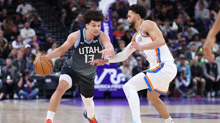 Dec 7, 2025; Salt Lake City, Utah, USA; Utah Jazz guard Walter Clayton Jr. (13) moves the ball as Oklahoma City Thunder guard Ajay Mitchell (25) defends during the second half at Delta Center. Mandatory Credit: Rob Gray-Imagn Images Dec 7, 2025; Salt Lake City, Utah, USA; Utah Jazz guard Walter Clayton Jr. (13) moves the ball as Oklahoma City Thunder guard Ajay Mitchell (25) defends during the second half at Delta Center. Mandatory Credit: Rob Gray-Imagn Images