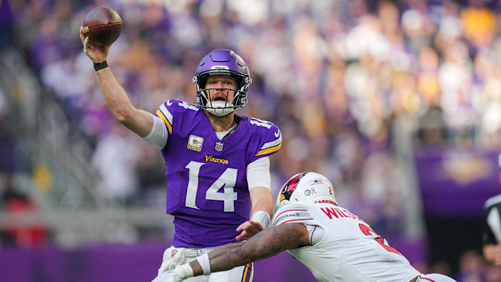Dec 1, 2024; Minneapolis, Minnesota, USA; Minnesota Vikings quarterback Sam Darnold (14) passes against the Arizona Cardinals in the third quarter at U.S. Bank Stadium. Dec 1, 2024; Minneapolis, Minnesota, USA; Minnesota Vikings quarterback Sam Darnold (14) passes against the Arizona Cardinals in the third quarter at U.S. Bank Stadium.