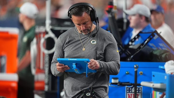 Green Bay Packers linebackers coach Anthony Campanile looks at a tablet in the second half against the Denver Broncos at Empower Field at Mile High during the 2024 preseason. Green Bay Packers linebackers coach Anthony Campanile looks at a tablet in the second half against the Denver Broncos at Empower Field at Mile High during the 2024 preseason.