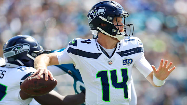 Seattle Seahawks quarterback Sam Darnold (14) looks to pass against the Jaguars.