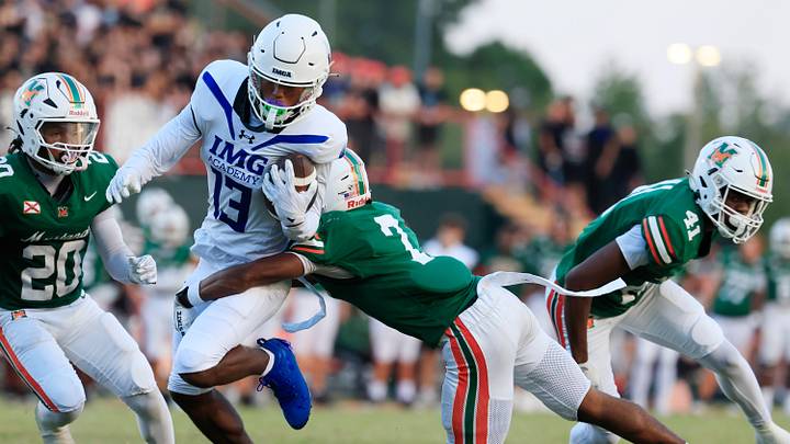 IMG Academy's Osani Gayles (13) gets up field in a 2025 game against Mandarin. 