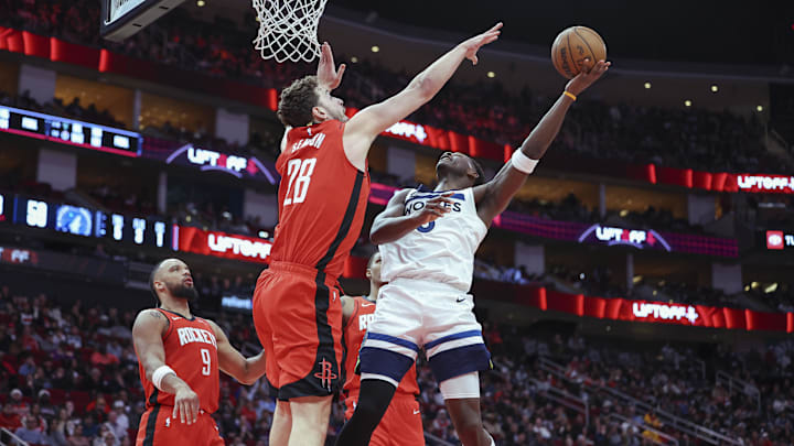 Feb 21, 2025; Houston, Texas, USA; Minnesota Timberwolves guard Anthony Edwards (5) shoots the ball as Houston Rockets center Alperen Sengun (28) defends during the game at Toyota Center. Mandatory Credit: Troy Taormina-Imagn Images
