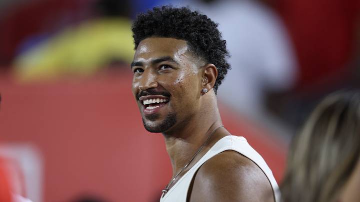 Sep 12, 2025; Houston, Texas, USA; Philadelphia 76ers player Quentin Grimes smiles while watching the game between the Houston Cougars and the Colorado Buffaloes at TDECU Stadium. Mandatory Credit: Troy Taormina-Imagn Images