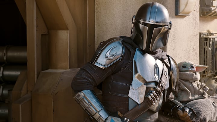The Mandalorian (Pedro Pascal) and the Child in THE MANDALORIAN, season two, exclusively on Disney+