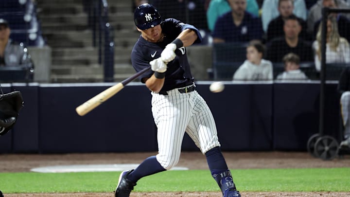 Mar 3, 2025; Tampa, Florida, USA; New York Yankees shortstop Anthony Volpe (11) singles during the second inning against the Pittsburgh Pirates at George M. Steinbrenner Field.