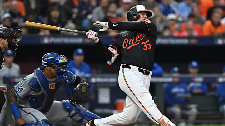 Oct 2, 2024; Baltimore, Maryland, USA; Baltimore Orioles catcher Adley Rutschman (35) hits a single against the Kansas City Royals in the fourth inning in game two of the Wild Card round for the 2024 MLB Playoffs at Oriole Park at Camden Yards. 