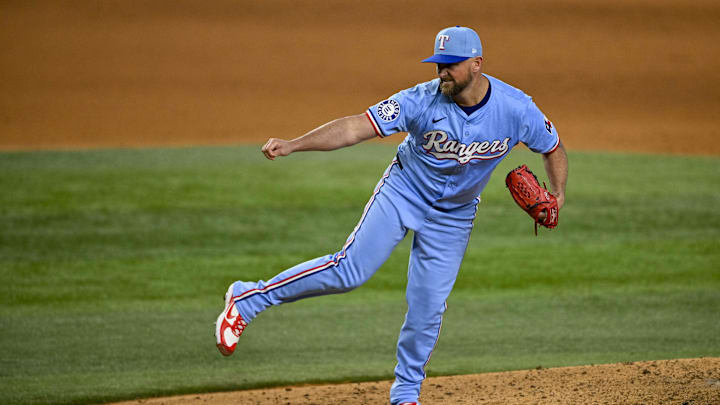 Sep 22, 2024; Arlington, Texas, USA; Texas Rangers relief pitcher Kirby Yates (39) pitches against the Seattle Mariners during the ninth inning at Globe Life Field.