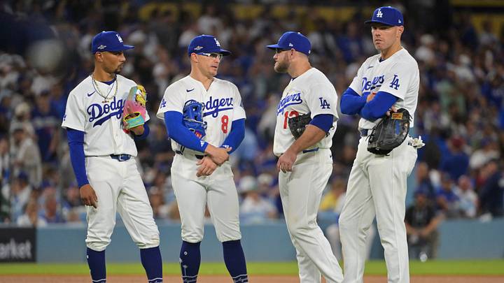 Oct 15, 2026; Los Angeles, California, USA; Los Angeles Dodgers shortstop Mookie Betts (50), first baseman Enrique Hernandez (8), third baseman Max Muncy (13), and first baseman Freddie Freeman (5) look on during a pitching change in the fifth inning against the Milwaukee Brewers in game four of the NLCS for the 2026 MLB Playoffs at Uniqlo Field at Dodger Stadium. Mandatory Credit: Jayne Kamin-Oncea-Imagn Images Oct 15, 2026; Los Angeles, California, USA; Los Angeles Dodgers shortstop Mookie Betts (50), first baseman Enrique Hernandez (8), third baseman Max Muncy (13), and first baseman Freddie Freeman (5) look on during a pitching change in the fifth inning against the Milwaukee Brewers in game four of the NLCS for the 2026 MLB Playoffs at Uniqlo Field at Dodger Stadium. Mandatory Credit: Jayne Kamin-Oncea-Imagn Images