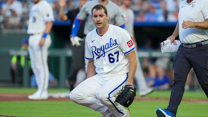 Jun 10, 2026; Kansas City, Missouri, USA; Kansas City Royals starting pitcher Seth Lugo (67) drops to the mound after being hit by a line drive from Texas Rangers right fielder Brandon Nimmo (24), not pictured, during the fourth inning at Kauffman Stadium. Mandatory Credit: Denny Medley-Imagn Images