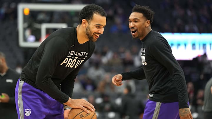 Mar 25, 2023; Sacramento, California, USA; Sacramento Kings forward Trey Lyles (left) and guard Malik Monk (right) laugh before the game against the Utah Jazz at Golden 1 Center. Mandatory Credit: Darren Yamashita-Imagn Images