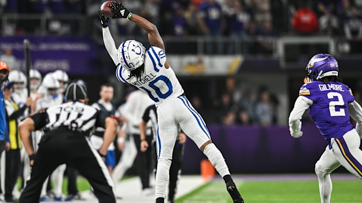 Nov 3, 2024; Minneapolis, Minnesota, USA; Indianapolis Colts wide receiver Adonai Mitchell (10) makes a catch during the fourth quarter as Minnesota Vikings cornerback Stephon Gilmore (2) defends at U.S. Bank Stadium. Mandatory Credit: Jeffrey Becker-Imagn Images
