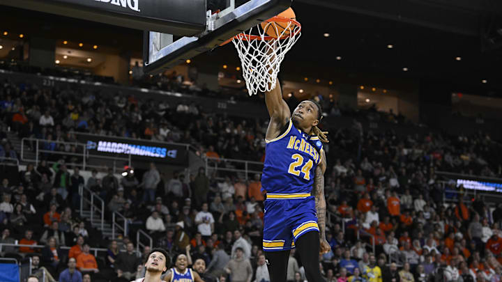 Mar 20, 2025; Providence, RI, USA; McNeese State Cowboys forward Christian Shumate (24) dunks against Clemson Tigers guard Chase Hunter (1) during the second half at Amica Mutual Pavilion. Mandatory Credit: Eric Canha-Imagn Images